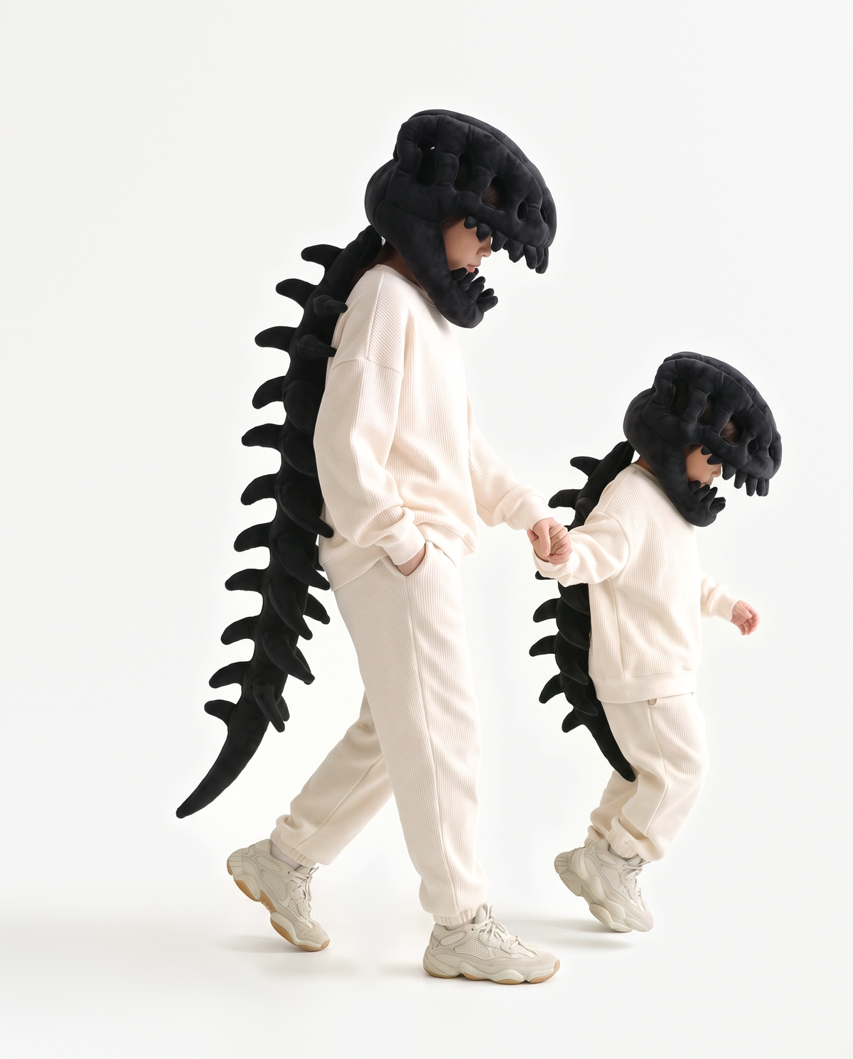 The Dinosaur Skeleton in Black worn with a friend — plush dinosaur skeleton costumes for pairs