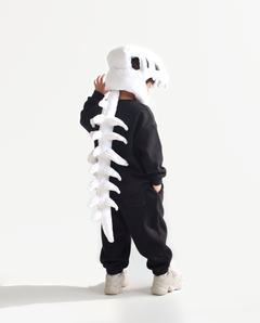 The Dinosaur Skeleton in Bone — plush dinosaur skeleton costume with skull hood and spine, side view
