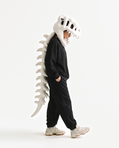 The Dinosaur Skeleton in Bone — plush dinosaur skeleton costume with skull hood and spine, side view