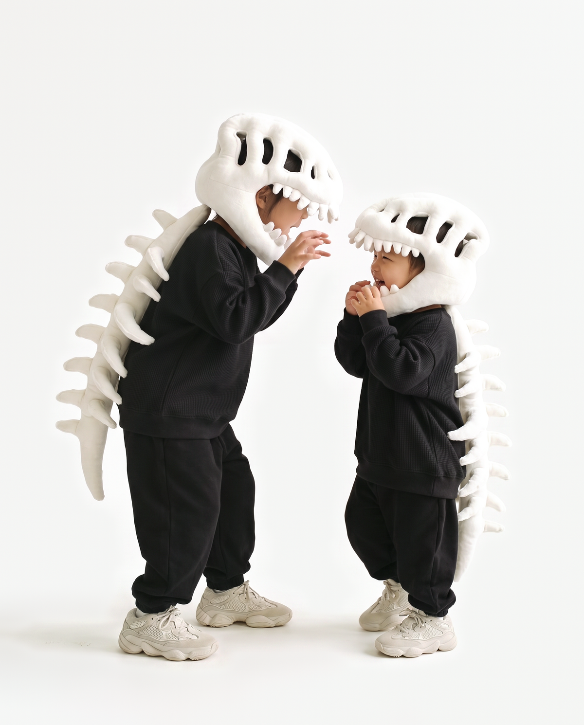 The Dinosaur Skeleton in Bone worn with a friend — plush dinosaur skeleton costumes for pairs