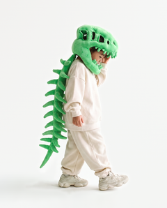 The Dinosaur Skeleton in Green — plush dinosaur skeleton costume seen from behind, spine down the back
