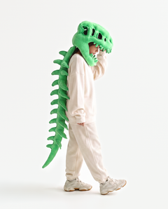 The Dinosaur Skeleton in Green — plush dinosaur skeleton costume with skull hood and spine, side view