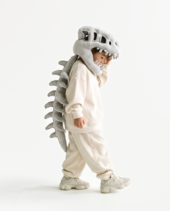 The Dinosaur Skeleton in Grey — plush dinosaur skeleton costume with skull hood and spine, side view