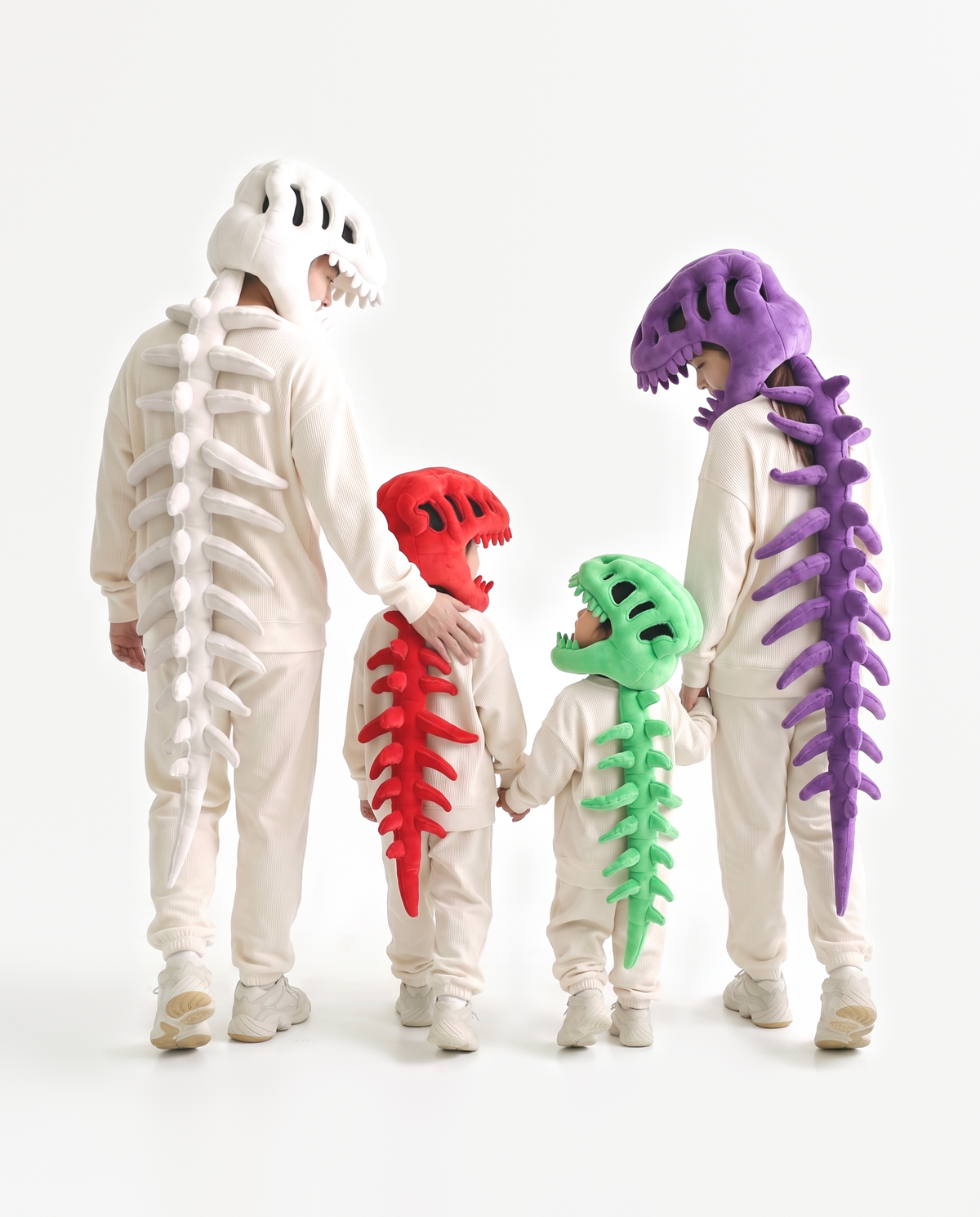 Plush Dinosaur Skeleton costumes in all six colors — grey, bone, black, green, red and purple