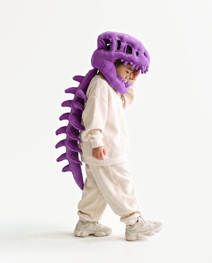 The Dinosaur Skeleton in Purple — plush dinosaur skeleton costume with skull hood and spine, side view