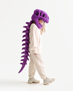 The Dinosaur Skeleton in Purple — plush dinosaur skeleton costume with skull hood and spine, side view