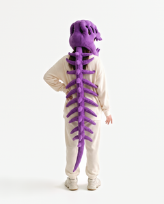 The Dinosaur Skeleton in Purple — plush dinosaur skeleton costume seen from behind, spine down the back