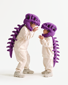 The Dinosaur Skeleton in Purple worn with a friend — plush dinosaur skeleton costumes for pairs