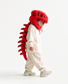 The Dinosaur Skeleton in Red — plush dinosaur skeleton costume with skull hood and spine, side view