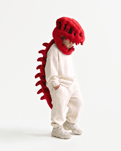 The Dinosaur Skeleton in Red — plush dinosaur skeleton costume with skull hood and spine, side view