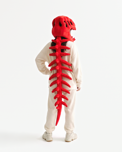The Dinosaur Skeleton in Red — plush dinosaur skeleton costume seen from behind, spine down the back