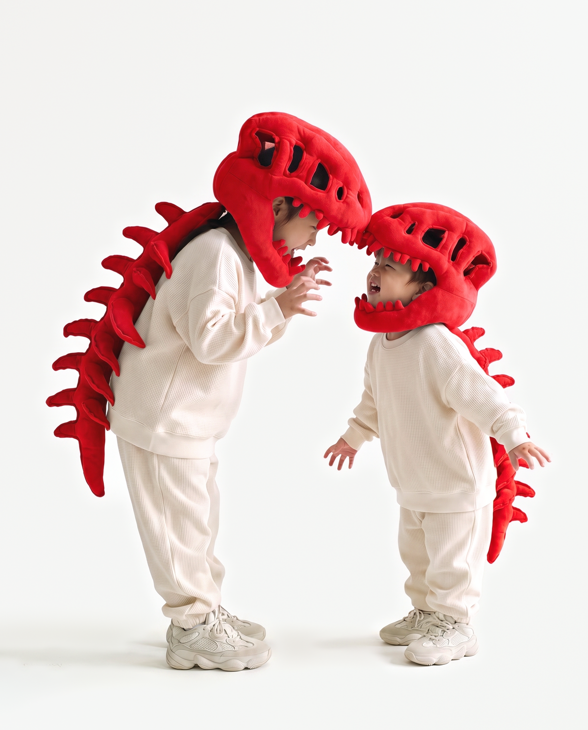 The Dinosaur Skeleton in Red worn with a friend — plush dinosaur skeleton costumes for pairs