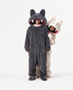 Cream and Charcoal Fang Onesies together — matching monster onesies with fangs for couples