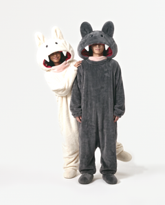 Cream and Charcoal Fang Onesies together — matching monster onesies with fangs for couples