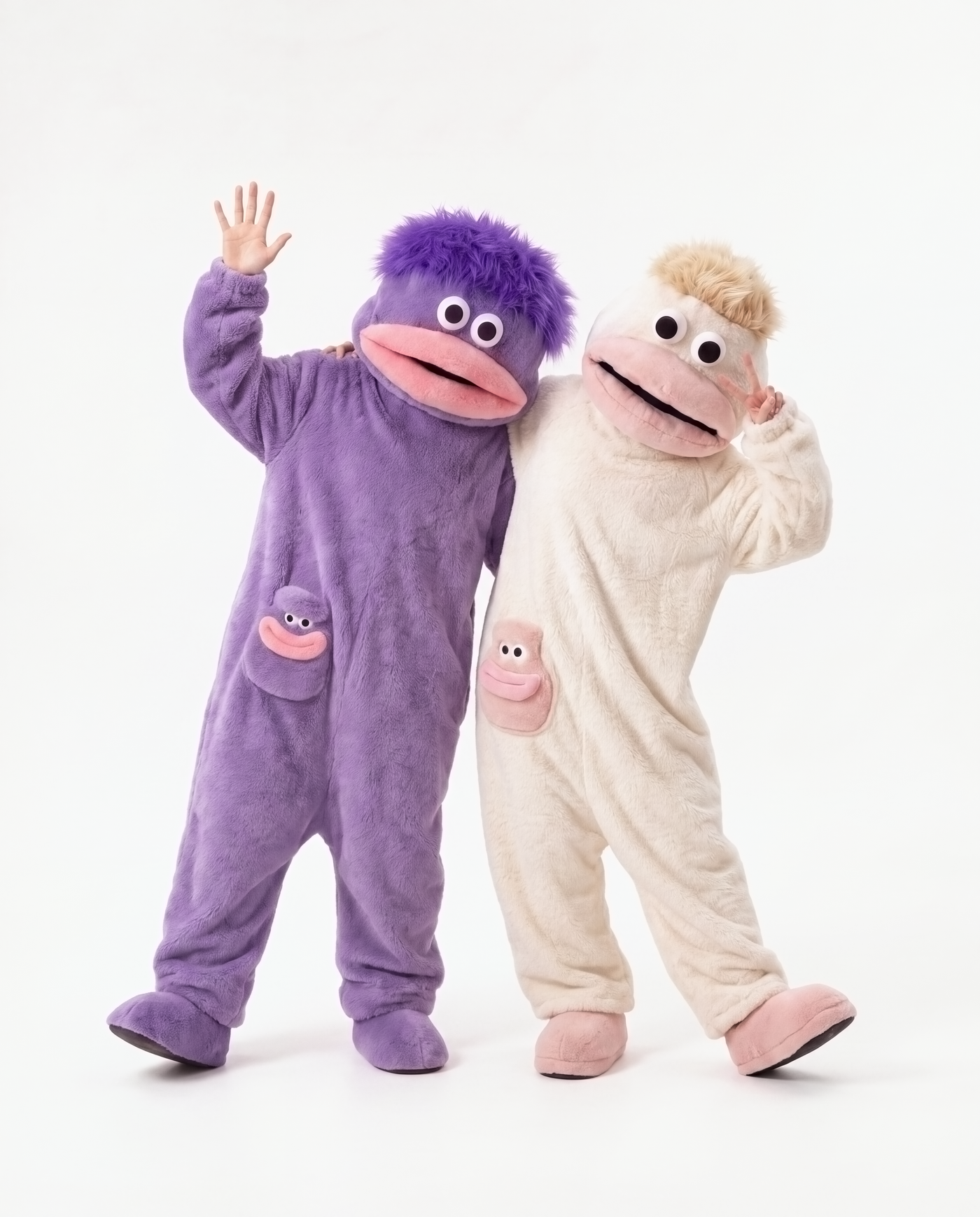Grape Fuzz and Coconut Cream monster onesies together