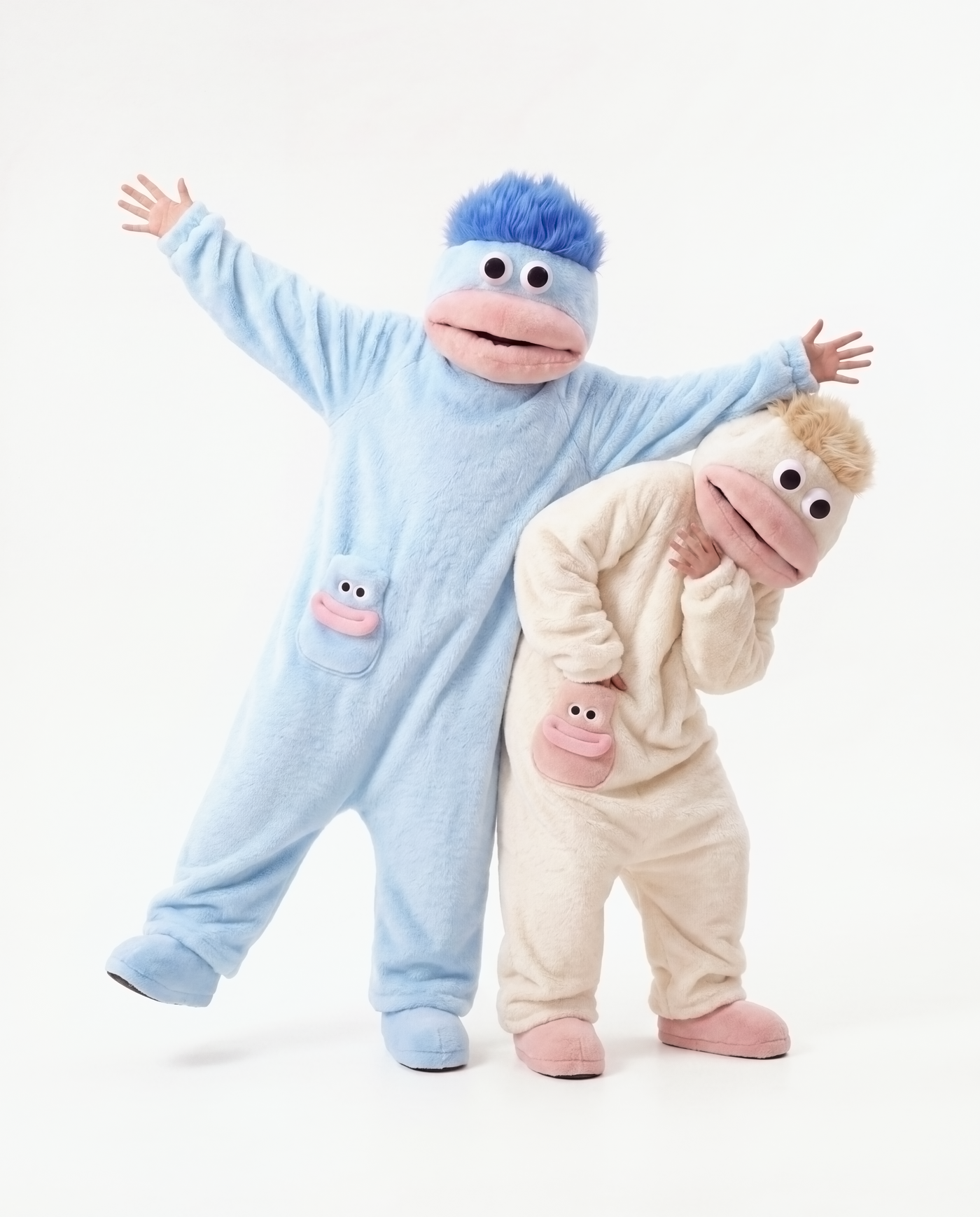 Coconut Cream and Cloud Blue monster onesies together