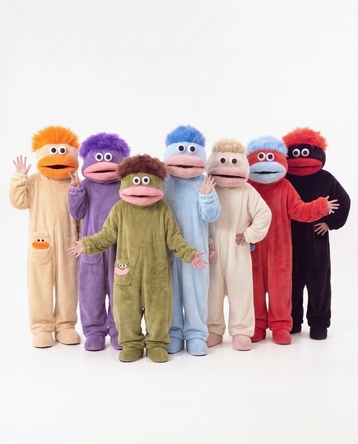 All seven monster onesies together